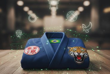 A folded blue BJJ Gi featuring a prominent patch with national symbols or cultural motifs